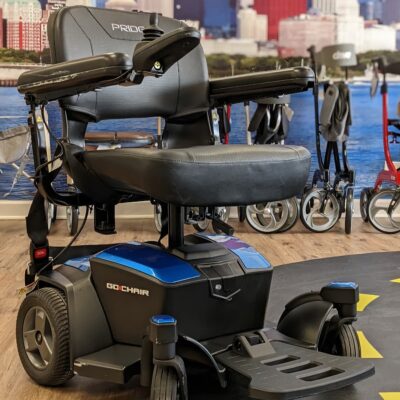 Used Pride Go-Chair power wheelchair with blue accents in Midwest Mobility showroom