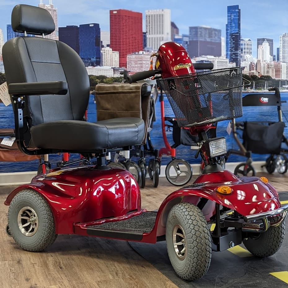 Used Golden Avenger mobility scooter with red accents in Midwest Mobility showroom