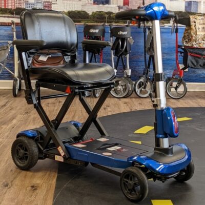 Used ZooMe mobility scooter with blue accents in Midwest Mobility showroom